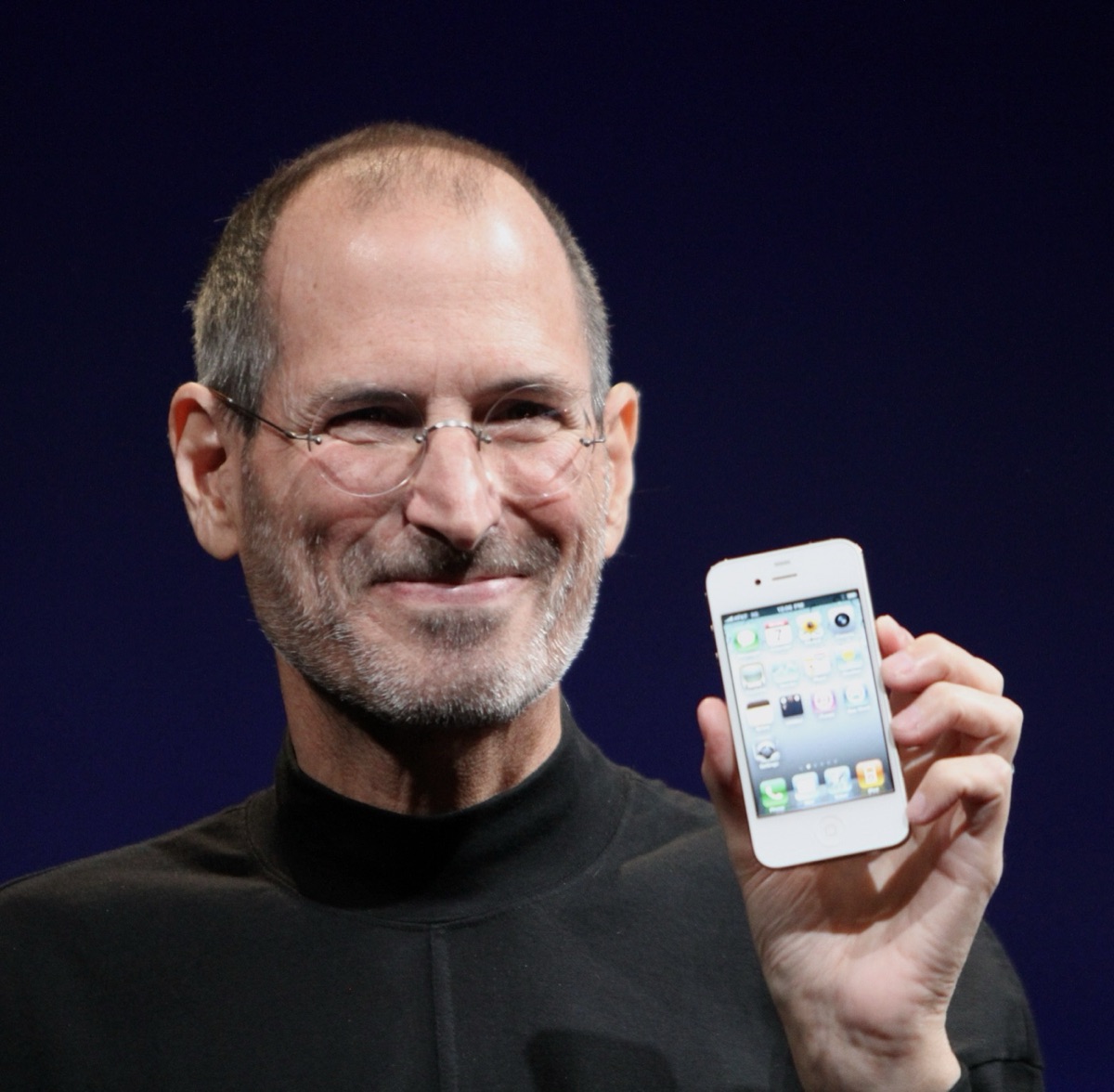 Steve Jobs holding the iPhone 4 at the 2010 Worldwide Developers Conference, photographed shortly after the iPhone era began transforming consumer technology