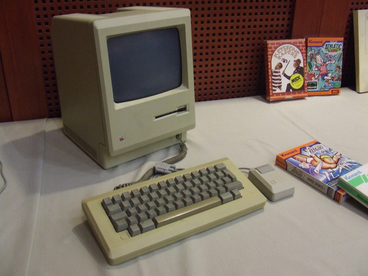 Original Apple Macintosh 128K product shot showing the iconic all-in-one compact design with the 9-inch monochrome CRT display