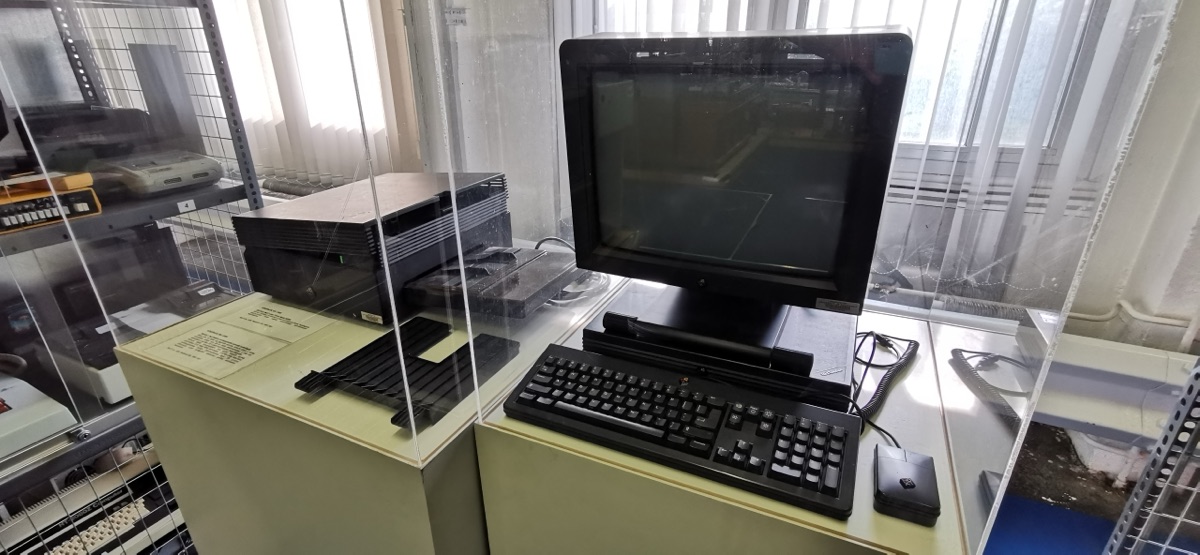 A complete NeXT workstation setup including the NeXTcube, monochrome display, and keyboard, displayed in a museum