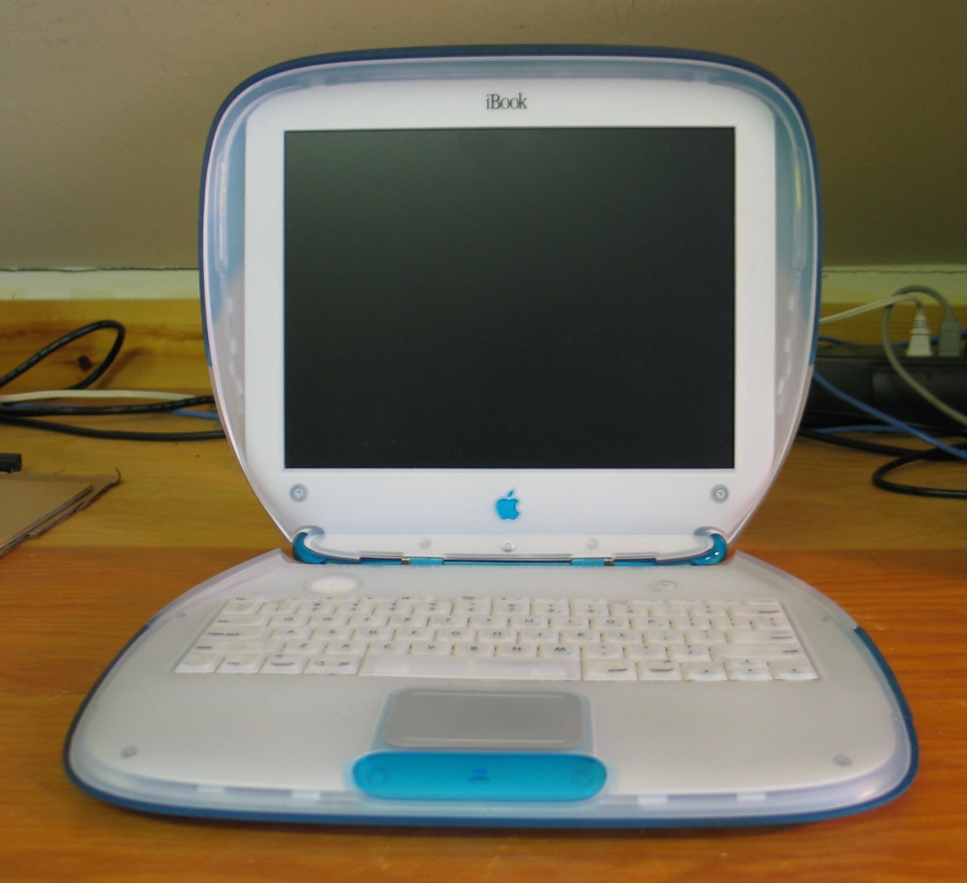 The original Apple iBook clamshell laptop from 1999 - the consumer-segment notebook that paired with the iMac in Apple's four-quadrant strategy